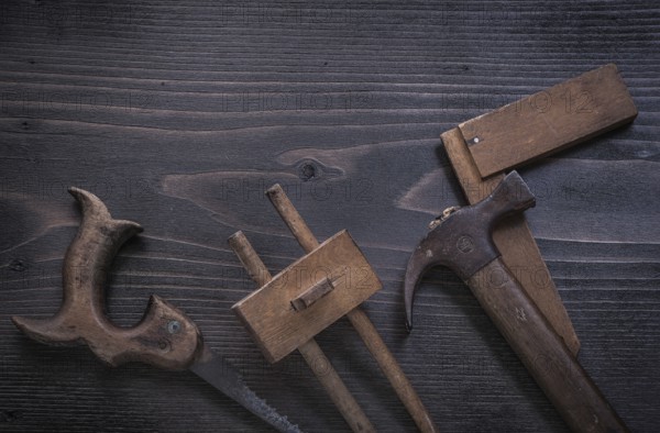 Rusted hand saw wooden marking gauge claw hammer square ruler
