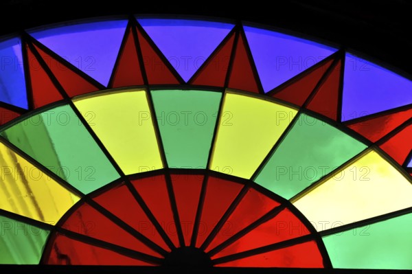 View of a colourful, wheel-shaped stained glass window with colourful segments, Havana, Cuba, Central America