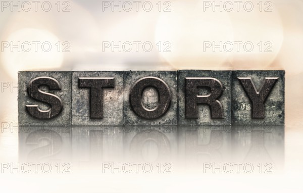 The word STORY written in vintage ink stained letterpress type