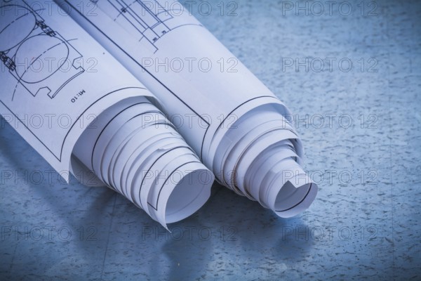 Close up image of construction plans on metallic background building and architecture concept