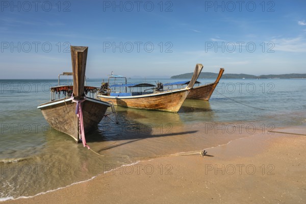 Tropical islands view with long tail boat ocean blue sea water and white sand beach, Krabi Thailand nature landscape