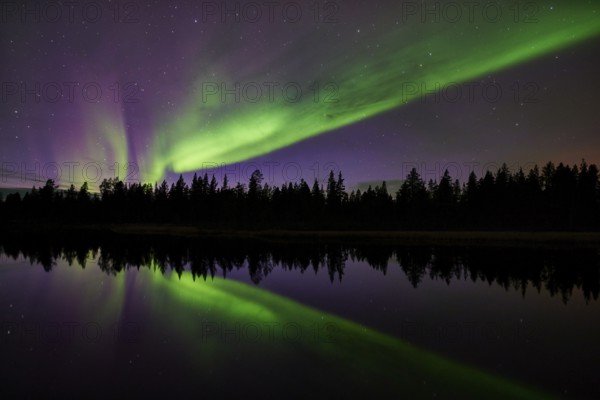 Northern lights reflected in a lake, Norrbotten, Lapland, Sweden, September 2014, Europe