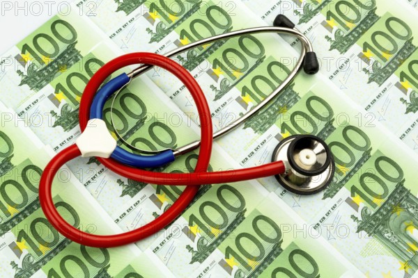 Stethoscope and euro banknotes. Symbolic photo for healthcare costs and for health insurance companies and medicine