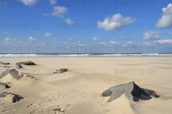 Beach landscape with rock in the foreground