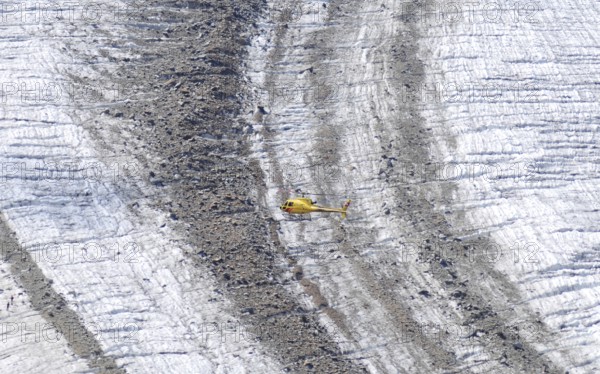 Helicopter flight over the Vadret Pers glacier underneath Piz Palü in the Bernina massif . Helicopter flight over the Vadret Pers glacier underneatz Piz Palü in the Upper Engadin