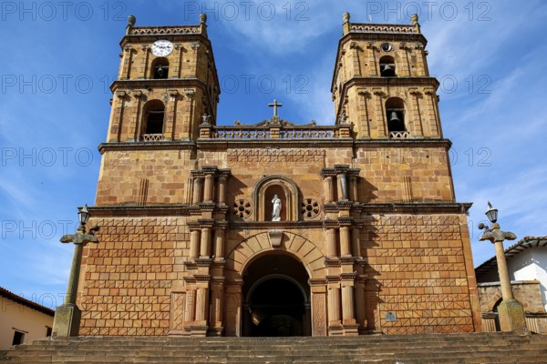 Front view of impressive colonial Cathedral of the Immaculate Conception against blue sky and veil clouds, Barichara, Colombia, South America