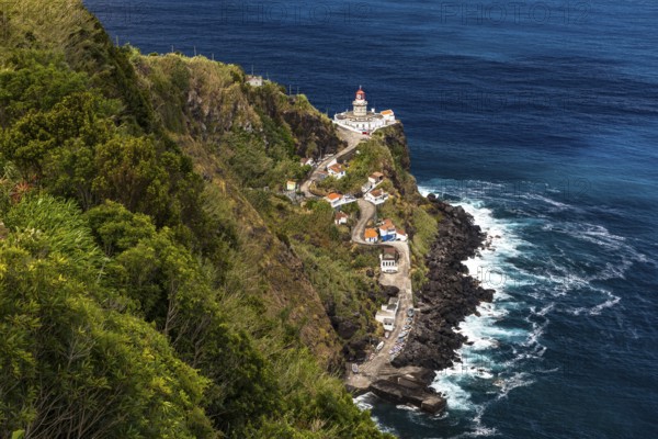 A panoramic view of the Nordeste lighthouse directly on the cliffs of the Azores island of Sao Miguel, Portugal, Europe