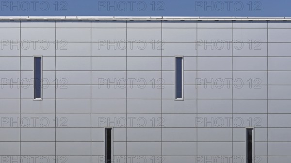Grey metal panels at commercial building exterior