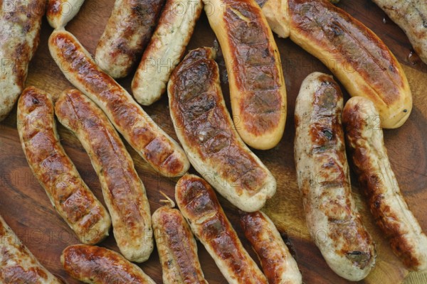 Grilled sausages on a wooden table