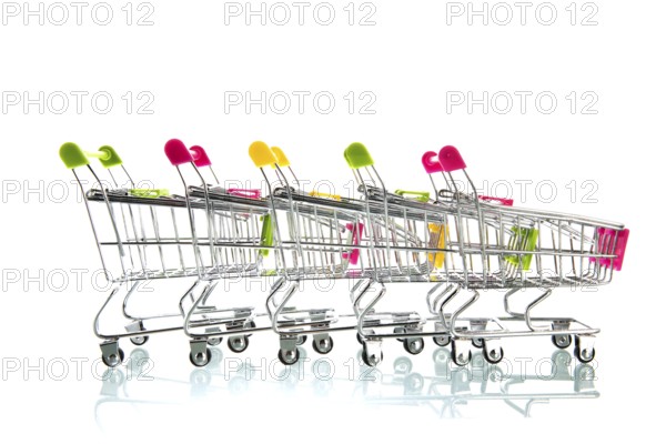 Row empty shopping carts isolated white background