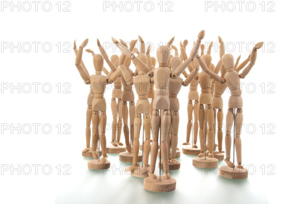 Many wooden mannequins isolated over white background