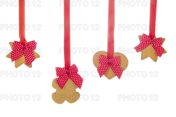 Hanging Christmas ginger bread cookies with ribbons and bows