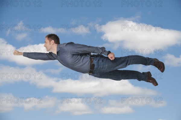 Handsome man flying or falling through the air