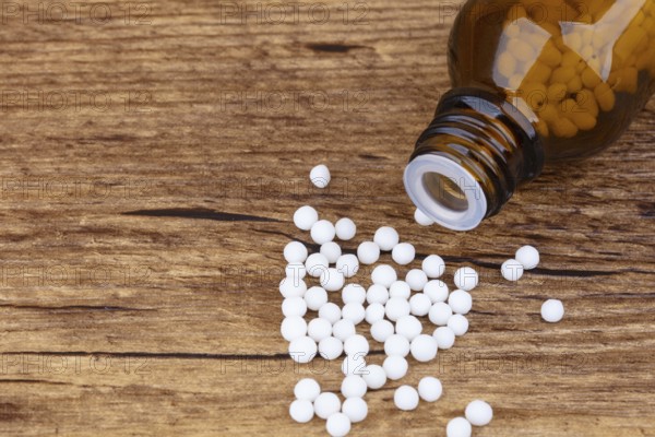 Homeopathy medicine on wooden background
