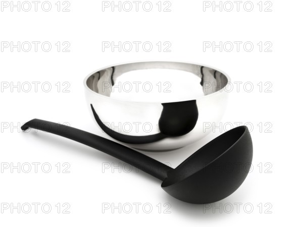 Soup Ladle Near the Metallic Bowl Against the White Background Riga, Latvia, Europe