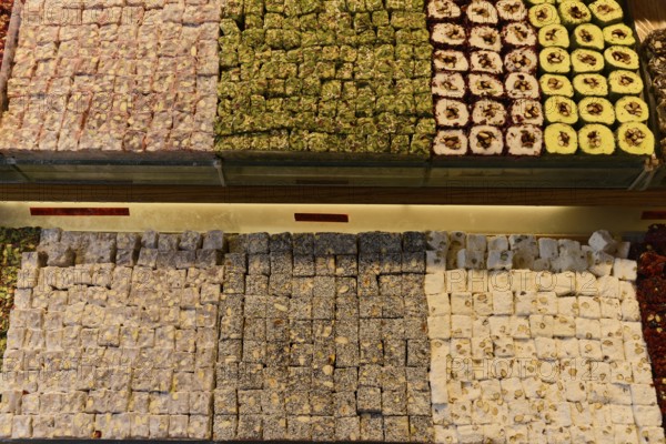 Sale, Sweets, Istiklal Caddesi shopping street, Beyoglu, Istanbul, European part, Istanbul province, Turkey, Asia, Varied selection of Turkish sweets with pistachios and nuts in rectangular trays, Istanbul Modern, Asia