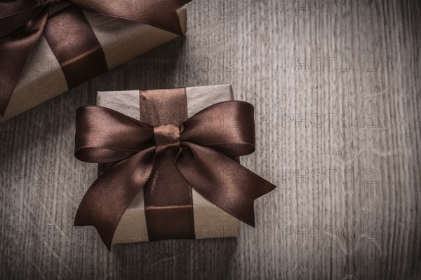 Present boxes with brown ribbons horizontal version celebration concept