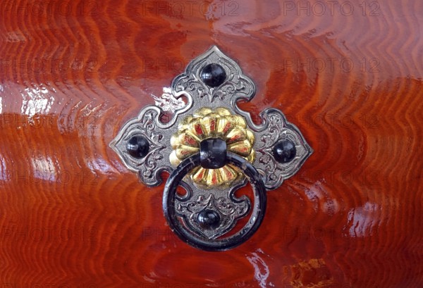 Silver color and brass color bronze fittings on a Japanese wooden Taiku drum