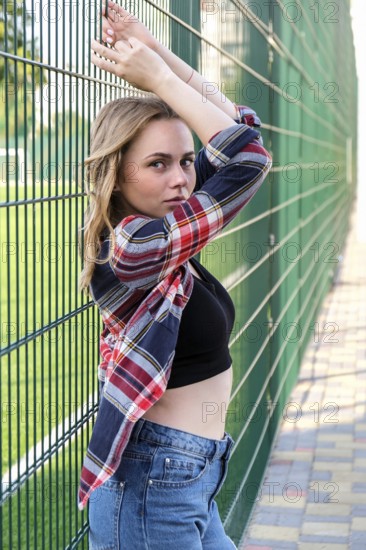 Portrait of young millennial woman on street. Hippie lifestyle. Happy smiling woman. Outdoors. Carefree