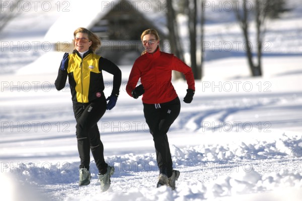 Running in the snow, man, 35, 40, years, running, running, snow, winter, two woman