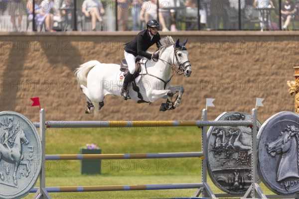 Daniel Coyle of Ireland and riding Incredible, compete in the 1.60m Grand Prix during The Continental international competition at Spruce Meadows, in Calgary, Canada, North America