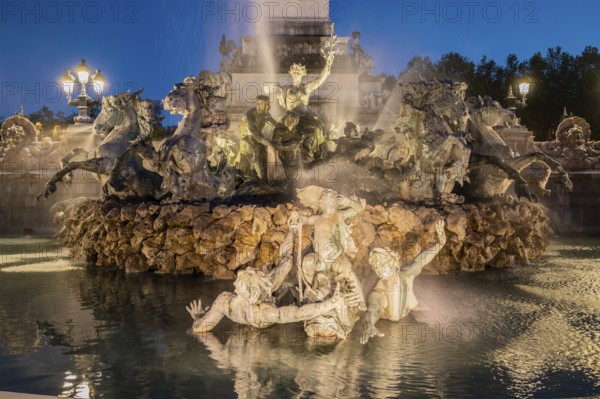 Place des Quinconces and Girondins fountain monument at night, Bordeaux, Aquitaine, France. High quality photo
