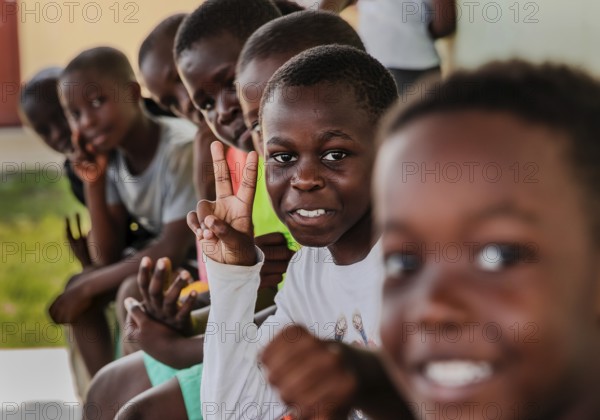 Children making a peace sign with their hands. Snapshot. It was taken during a rubbish collection project in a social housing community. Recycling.Libreville, Gabon, Africa