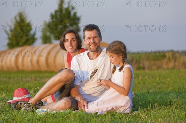 Family on a summer meadow, Altdöbern, Brandenburg, Germany, Europe