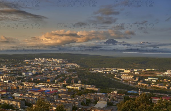 Petropavlovsk-Kamchatsky city at sunset and cone of Koryak volcano. Kamchatka Peninsula, Russia, Europe