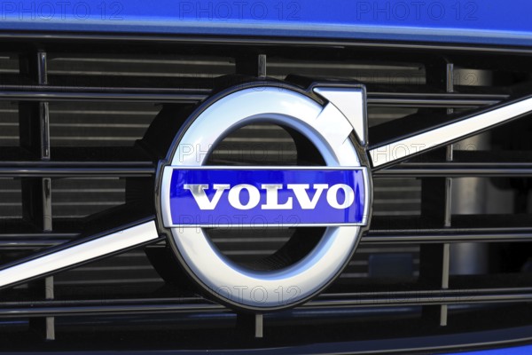 TURKU, FINLAND, JULY 29, 2017: Sign Volvo on the grille of a new blue car. Carmaker Volvo announces that all their new cars launched from 2019 onwards will be partially or completely battery-powered