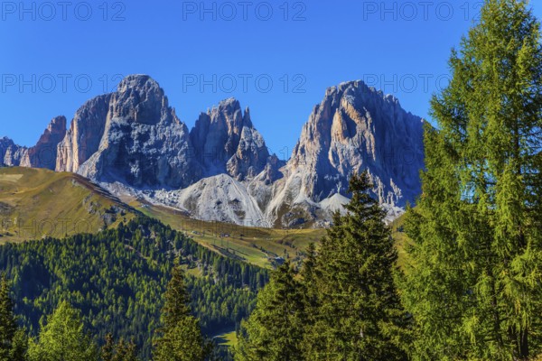 The most picturesque route in the Italian Dolomites, the Southern Limestone Alps. The coniferous forests at the foot of limestone and dolomite rocks. The concept of active and car tourism