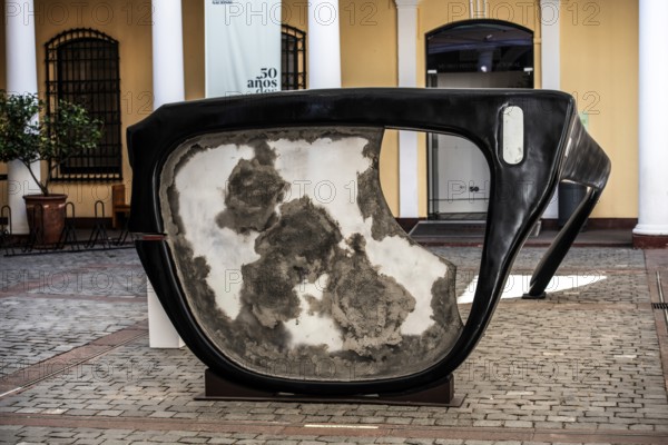 Broken horn-rimmed glasses as a work of art in memory of Salvador Allende Gossens in the courtyard of the National Museum in Plaze da Armas, Santiago de Chile, Chile, South America