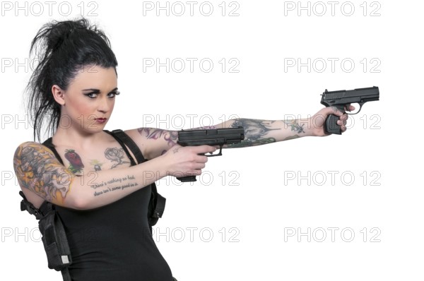 Beautiful young tattooed woman with a pistols