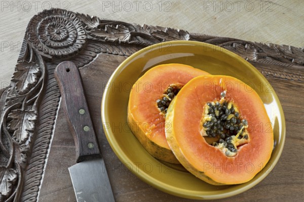 Pawpaw slices on a walnut tray (Kashmir, hand-carved)