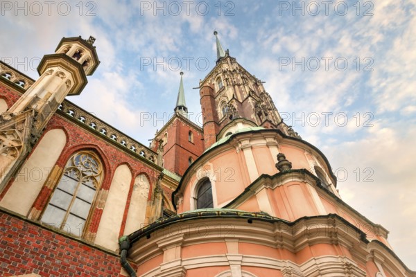 Towers of Wroclaw Cathedral on a background of cloudy sky, Poland, Europe