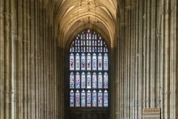 Canterbury, United Kingdom, 10 September, 2022: stained glass window and Gothic architecture columns of the central nave inside the historic Canterbury Cathedral, Europe