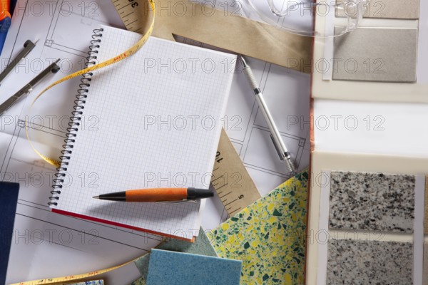 Architect or interior designer workplace desk with spiral notebook blank copy space