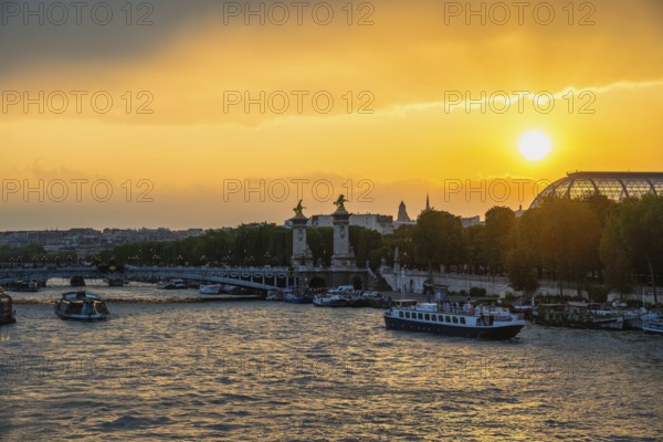 Paris France, city skyline sunset at Seine River with Pont Alexandre III bridge and Grand Palais