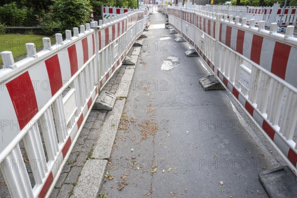 Construction site barrier of a road with a sidewalk