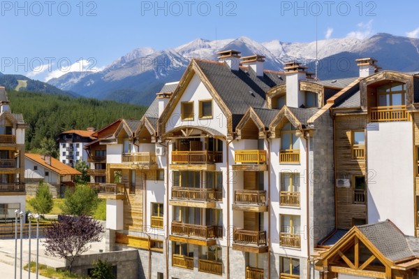 Bansko, Bulgaria summer view with houses and Pirin peaks panorama