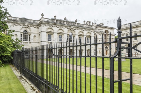CAMBRIDGE, UK, AUGUST 11, 2015: Iron fence in a College of the University of Cambridge. Cambridge is a university city and one of the top five universities in the world