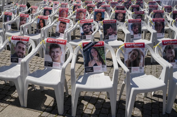 17.05.2024, Berlin, Germany, Europe, Portraits of the abducted Israeli hostages are attached to empty chairs on Bebelplatz in Berlin-Mitte in a symbolic installation commemorating the more than 130 hostages, most of them Israeli, who have been held captive by the terrorist organisation Hamas since 7 October 2023, i.e. for more than 200 days, as well as those who have been murdered during this period. For this purpose, part of the square will be temporarily transformed into, Europe