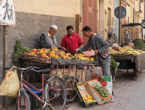 Taroudant, Morocco, 21 March, 2024: greengrocer selling fruit from his pushcart in the streets of Taroudant, Africa