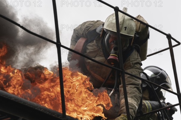 PETROPAVLOVSK-KAMCHATSKY, KAMCHATKA PENINSULA, RUSSIA, AUG 7, 2019: Firefighters of Fire Department ? 1 of Federal Fire Service in Kamchatka during fire extinguishing, training to overcome fire zone of psychological training for firefighters