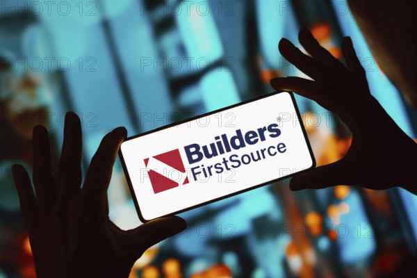 In this photo illustration, the Builders FirstSource logo is displayed on a smartphone screen