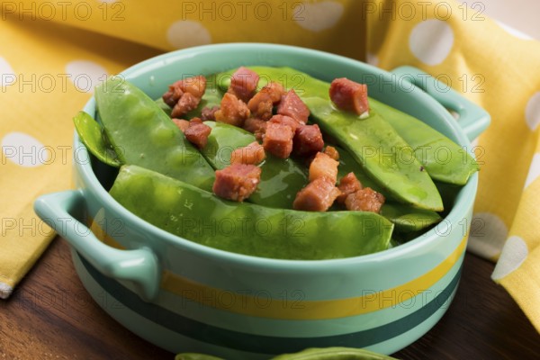 Fresh green peas with bacon