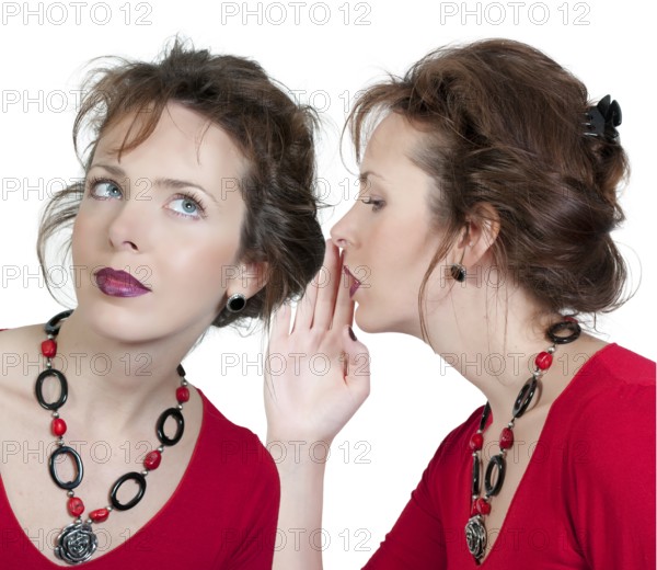 A young beautiful woman whispering a secret