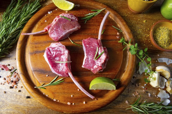 Raw fresh lamb chops Wooden chopping board
