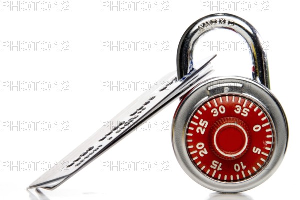 A set of credit cards secured with a padlock