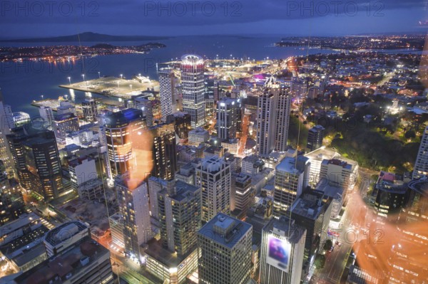 Amazing aerial view of Auckland skyline at night. City buildings and skyscrapers, New Zealand, Oceania